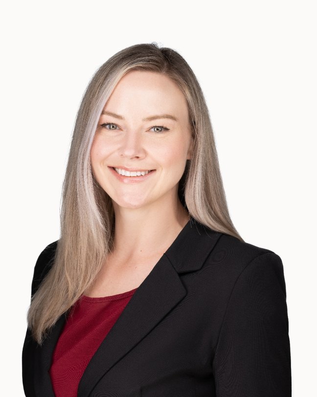 Hali O'Malley, wide studio portrait.